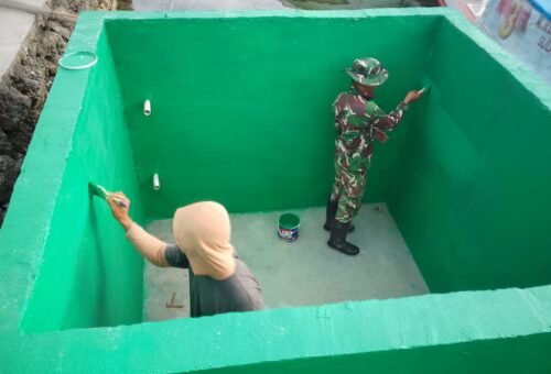Penyelesaian Proyek TMMD Ke-129 Kodim 1311/Morowali: Pengecatan Bak Penampungan Air di Desa Umbele